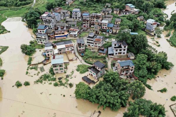 Flooded fields and buildings following heavy rains in Rongan, Guangxi, China, on June 13, 2022. (STR/AFP via Getty Images)