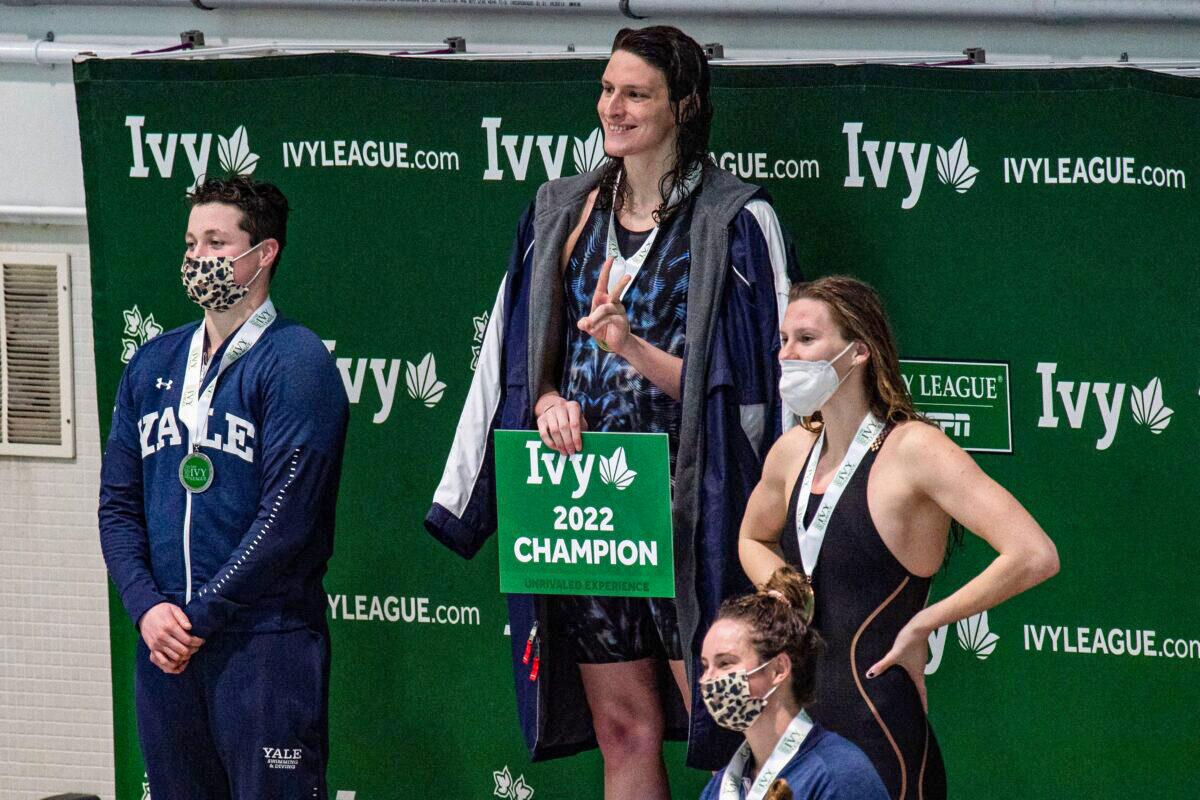 Transgender swimmer Lia Thomas (2L) of Penn University and transgender swimmer Iszac Henig (L) of Yale pose with their medals after placing first and second in the 100-yard freestyle swimming race at the 2022 Ivy League Women's Swimming and Diving Championships at Harvard University in Cambridge, Mass., on Feb. 19, 2022. (Joseph Prezioso/Getty Images)
