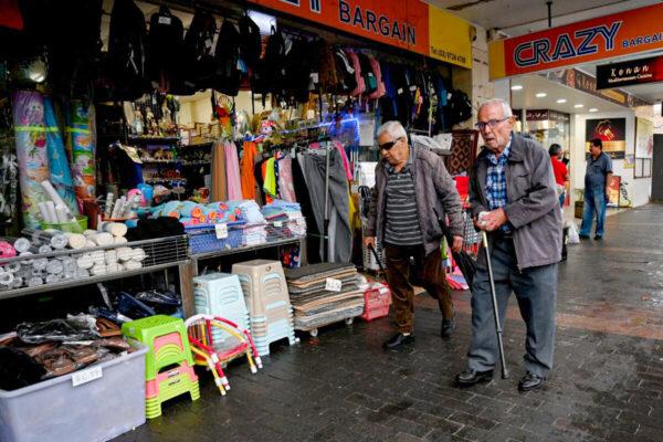 People shop at a market in a suburb of western Sydney, Australia, on April 27, 2022. (Saeed Khan/AFP via Getty Images)