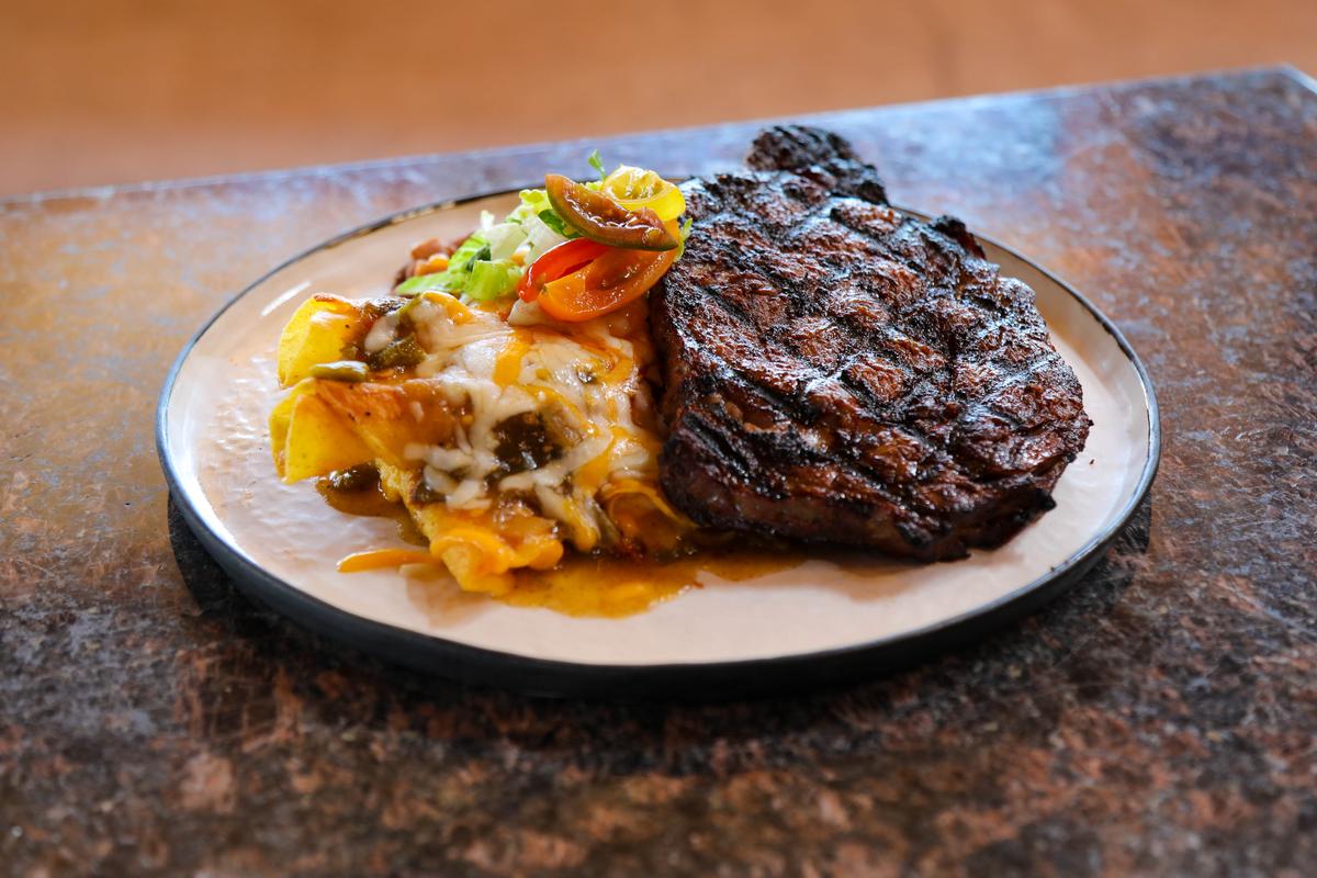  The restaurant uses beef raised by Native American ranchers, for dishes like the hand-cut ribeye served with rolled enchiladas, red or green chile, melted cheese, and Pueblo beans. (Courtesy of the Indian Pueblo Cultural Center)