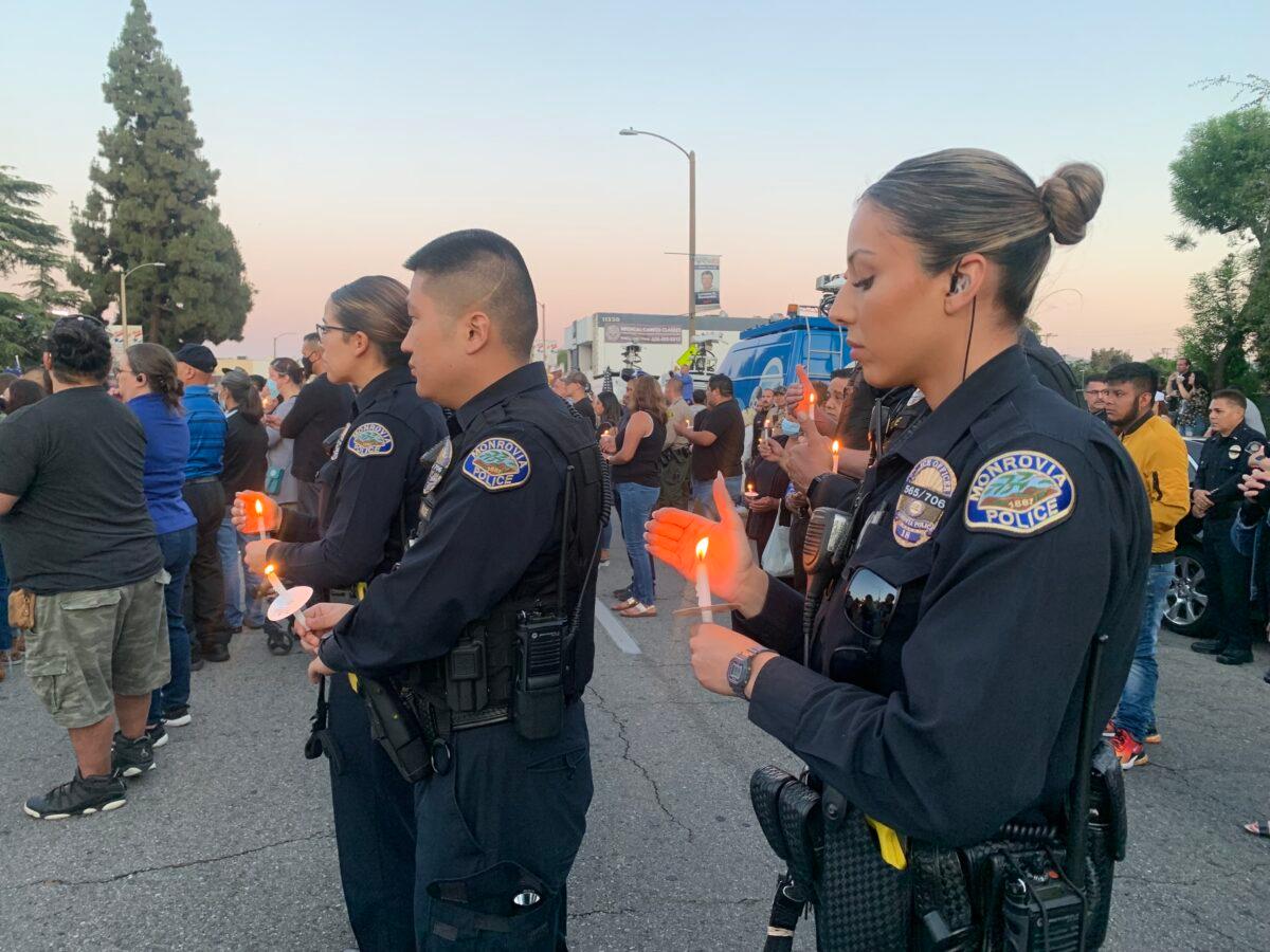 In honor of two El Monte police officers killed in a recent motel shooting, hundreds of community members, law enforcement officers, and family members gathered at a candlelight vigil outside the El Monte Civic Center in El Monte, Calif., on June 18, 2022. (Linda Jiang/The Epoch Times)