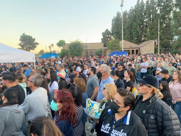 In honor of two El Monte police officers killed in a recent motel shooting, more than a thousand community members, law enforcement officers, and family members gathered at a candlelight vigil outside the El Monte Civic Center in El Monte, Calif., on June 18, 2022. (Linda Jiang/The Epoch Times)