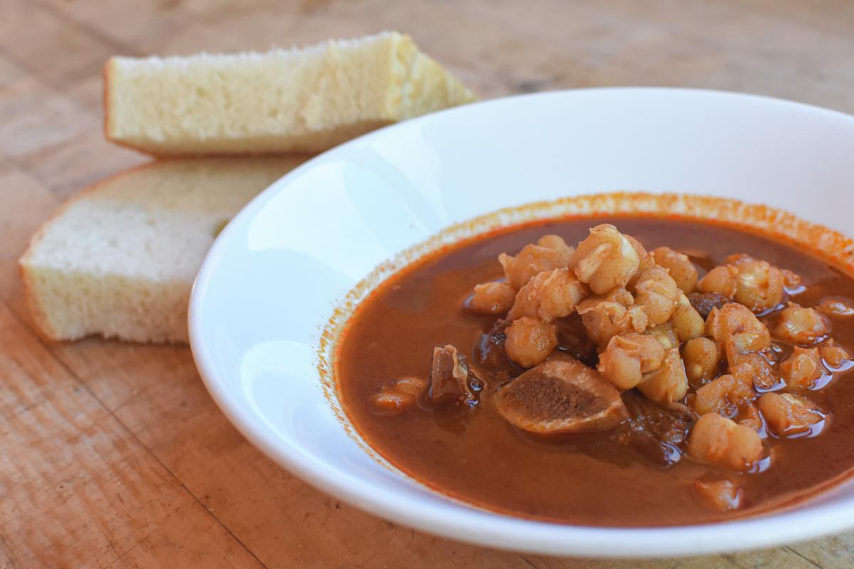 The Pueblo stews—such as this one with red chile, beef bone, and posole—are the soul of the menu. (Courtesy of the Indian Pueblo Cultural Center)