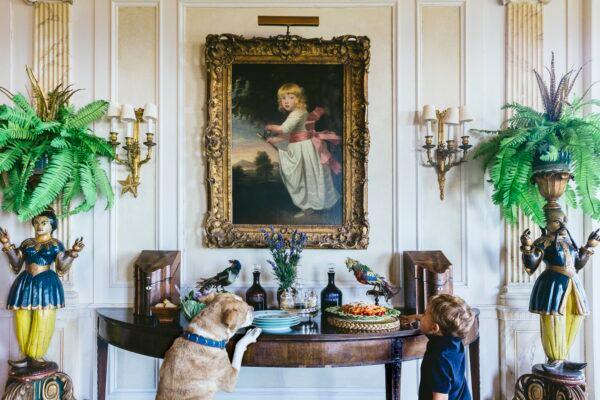 Nick Mele’s son Johnny and dog Bodhi take a peek at what’s on the table at the family home in Newport, R.I. (Courtesy of Nick Mele)