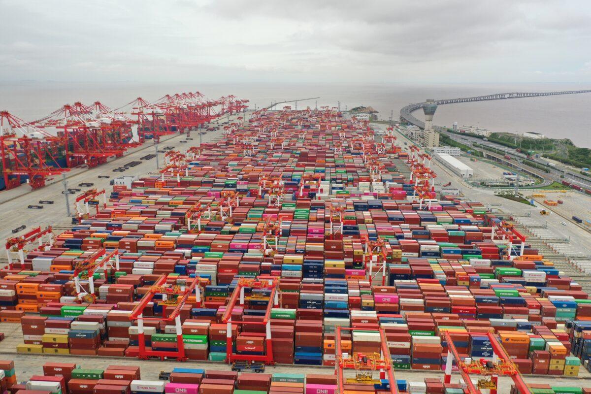 Aerial view of shipping containers stacked at Yangshan Deepwater Port in Shanghai on May 19, 2021. (Shen Chunchen/VCG via Getty Images)