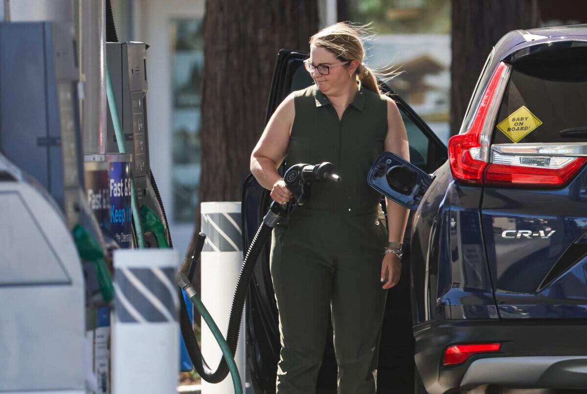 A customer prepares to pump gasoline into her car at a Chevron station in San Rafael, Calif., on May 20, 2022. (Justin Sullivan/Getty Images)
