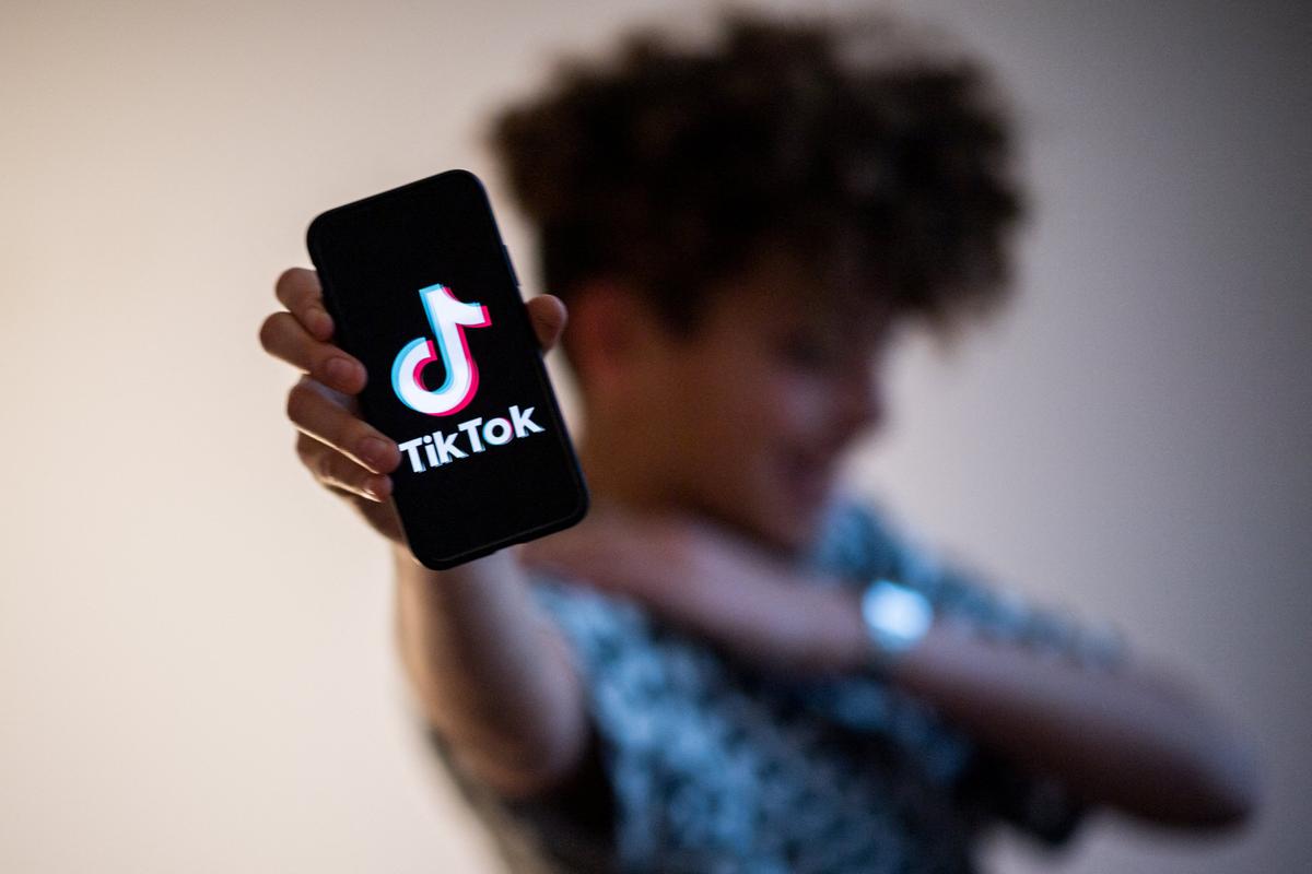 A teenager presents a smartphone with the logo of Chinese social network Tik Tok in Nantes, western France, on Jan. 21, 2021. (Loic Venance/AFP via Getty Images)