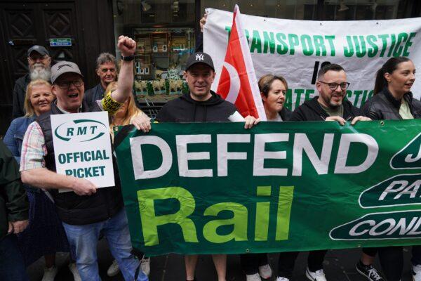 RMT union members stand on the picket line outside Glasgow Central Station, in Scotland, on June 21, 2022. (PA Media)