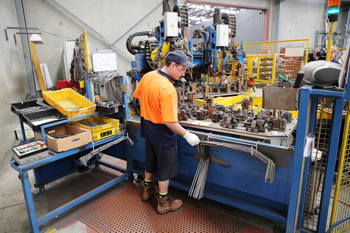 An employee works at the Multi Slide Industries manufacturing plant in Adelaide, Australia, on Aug. 12, 2013. (Morne de Klerk/Getty Images)