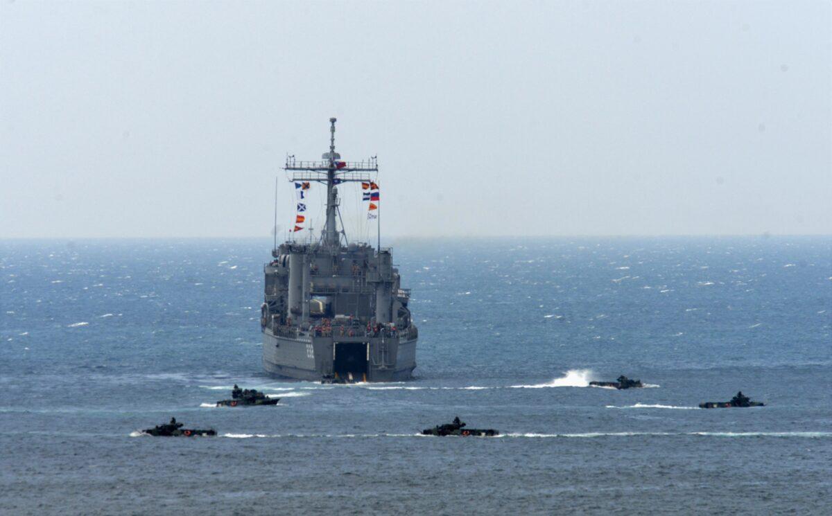 A Taiwanese landing ship is surrounded by amphibious assault vehicles during a life-fire drill, some 4 miles from the city of Magong on the outlying Penghu islands on May 25, 2017. (Sam Yeh/AFP)
