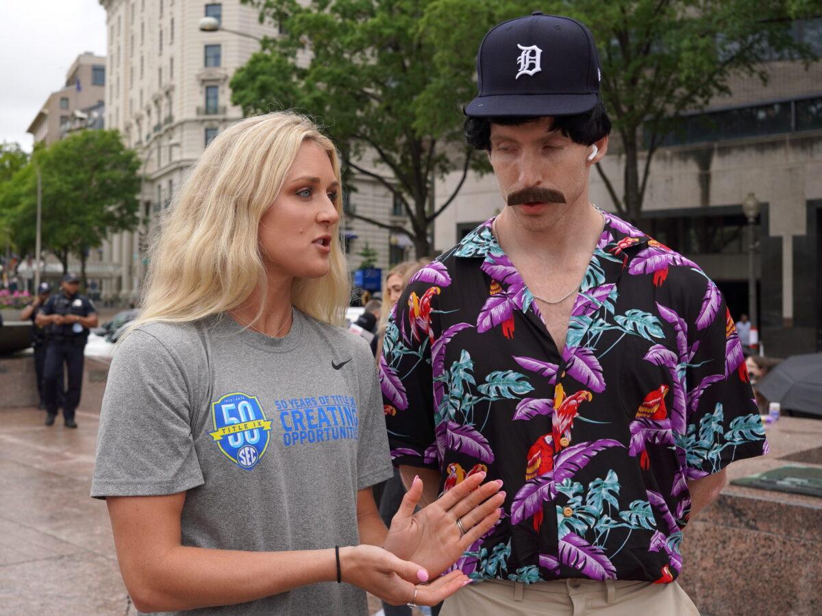 Riley Gaines Barker, a former University of Kentucky swimmer who tied for fifth place against transgender swimmer Lia Thomas at the NCAA Championships in March, is interviewed by a YouTuber at Freedom Plaza in Washington on June 23, 2022. (Terri Wu/The Epoch Times)