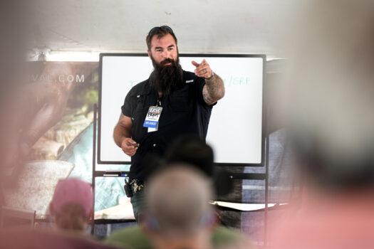 TJ Morris, the host of The Prepper Classroom, speaks at the Self-Reliance Festival in Camden, Tenn., on June 12, 2022. (Charlotte Cuthbertson/The Epoch Times)