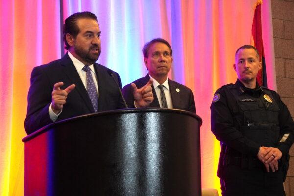 Arizona Attorney General Mark Brnovich (L) discusses the problem of human trafficking in Arizona at a press conference in Scottsdale, Ariz., on June 22. (Allan Stein/The Epoch Times)