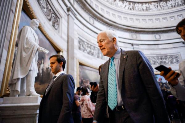 Senate Minority Whip John Cornyn (R-Texas) talks to reporters as he walks through the U.S. Capitol Rotunda in Washington on June 23, 2022. (Chip Somodevilla/Getty Images)