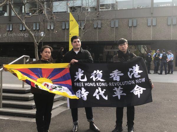 Drew Pavlou, pro-democracy Hong Kong activist Max Mok, and Kyinzom Dhongdue from the local Tibetan community held flags and banners in front of the UTS building. (The Epoch Times)