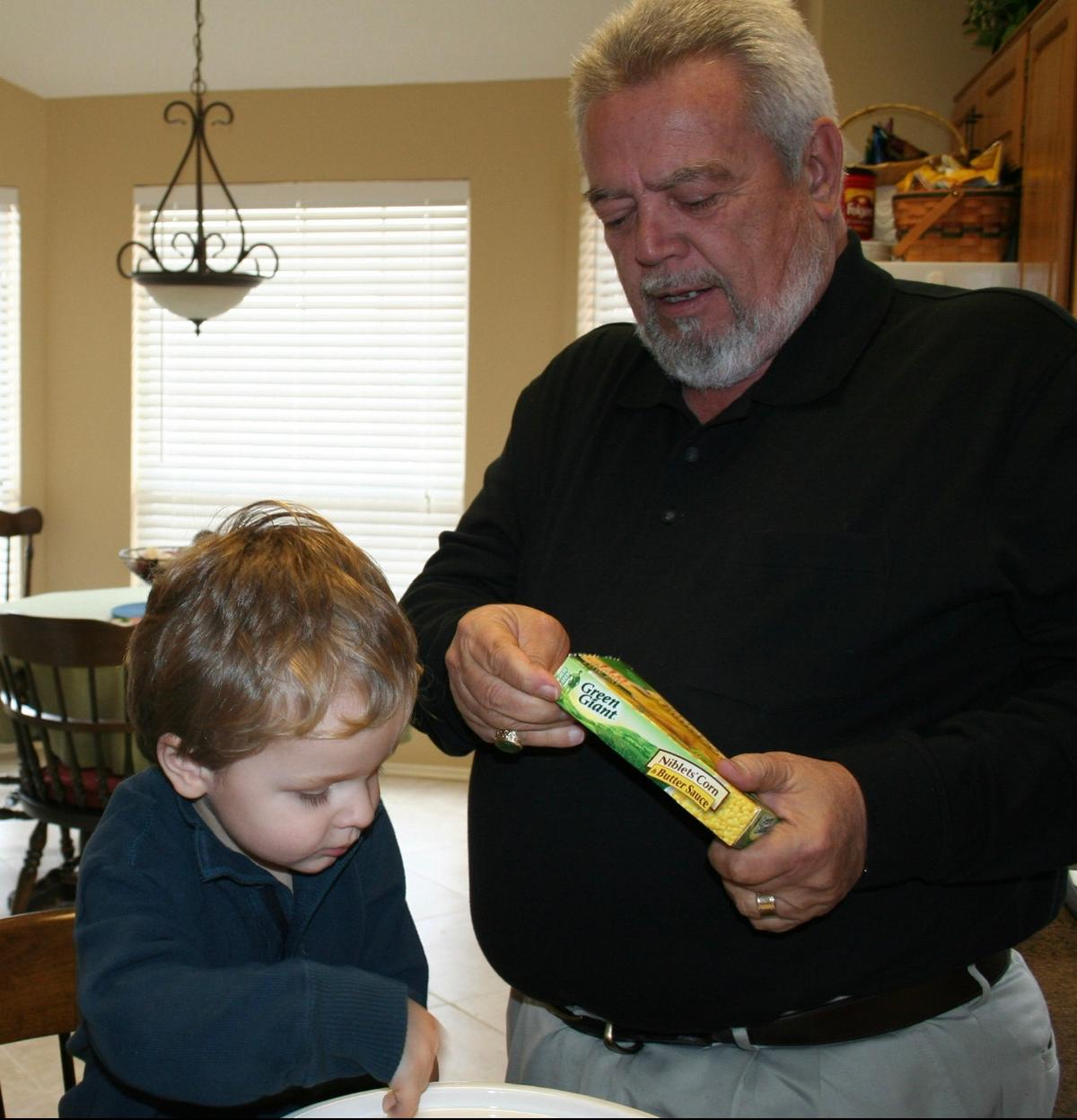 Jacob and his grandpa trying to cook when he was very little. (Courtesy of <a href="https://www.facebook.com/poppopsdandydog/">Jacob Irving</a>)