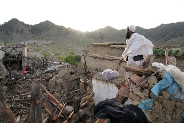A man stands among destruction after an earthquake in Gayan village, in Paktika province, Afghanistan, on June 23, 2022.(Ebrahim Nooroozi/AP Photo)