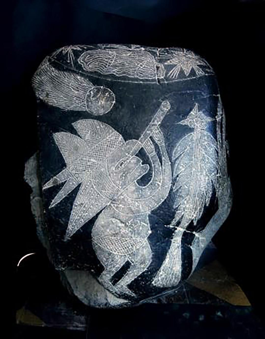 This Ica Stone depicts a person wearing a headdress, observing a comet through a telescope. (Courtesy of Eugenia Cabrera)