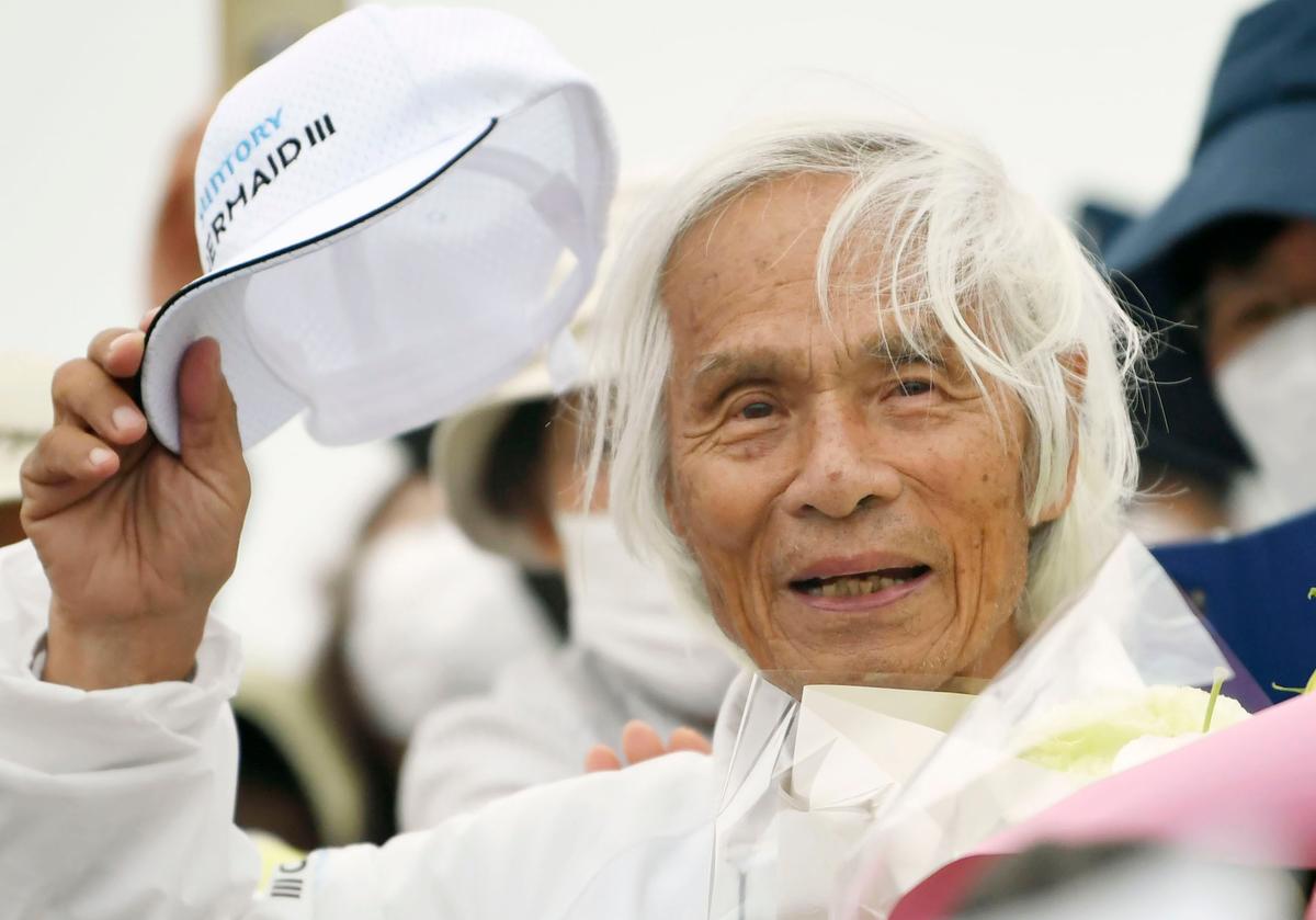 Horie, welcomed at a yacht harbor in Nishinomiya, western Japan, Sunday, June 5, 2022. (Kosuke Moriwaki/Kyodo News via AP)