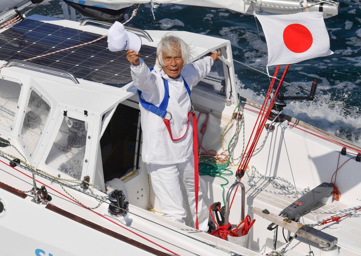 Horie is welcomed home at Osaka Bay after completing his trans-Pacific voyage on June 4, 2022. (Kyodo News via AP)