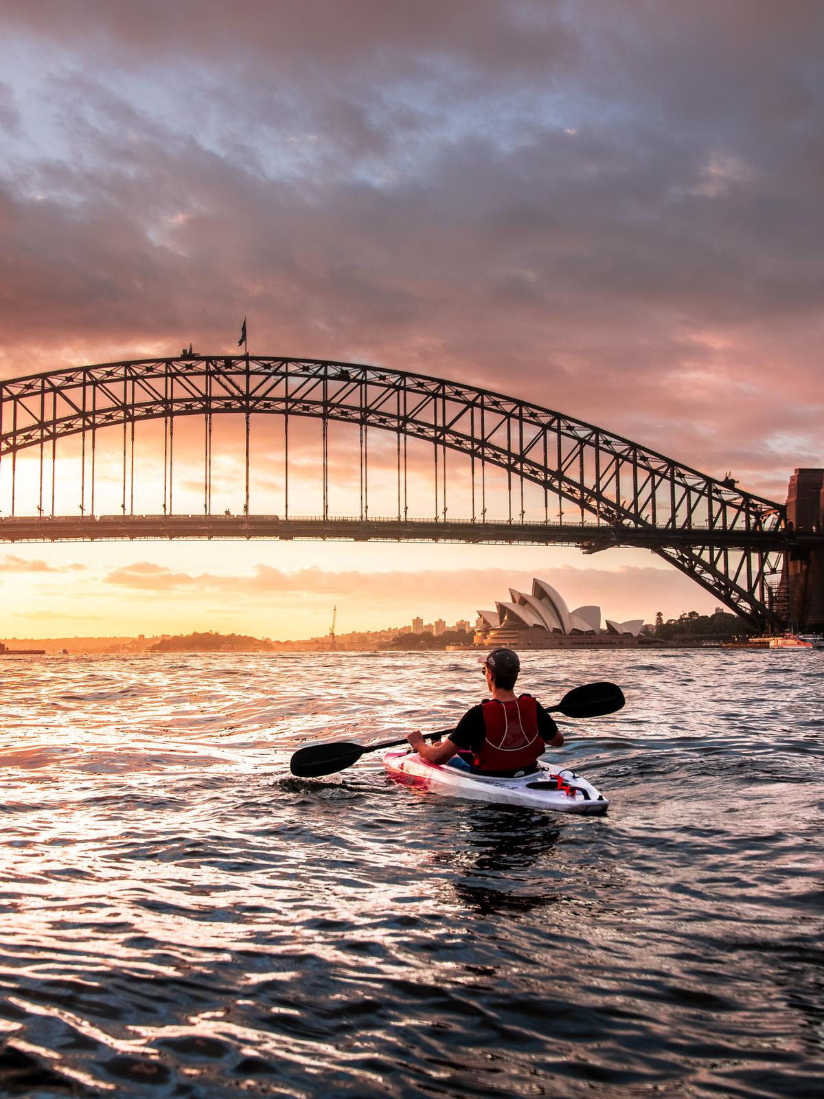 A kayaker in Sydney Harbor. ( Mads Schmidt Rasmussen/Unsplash)
