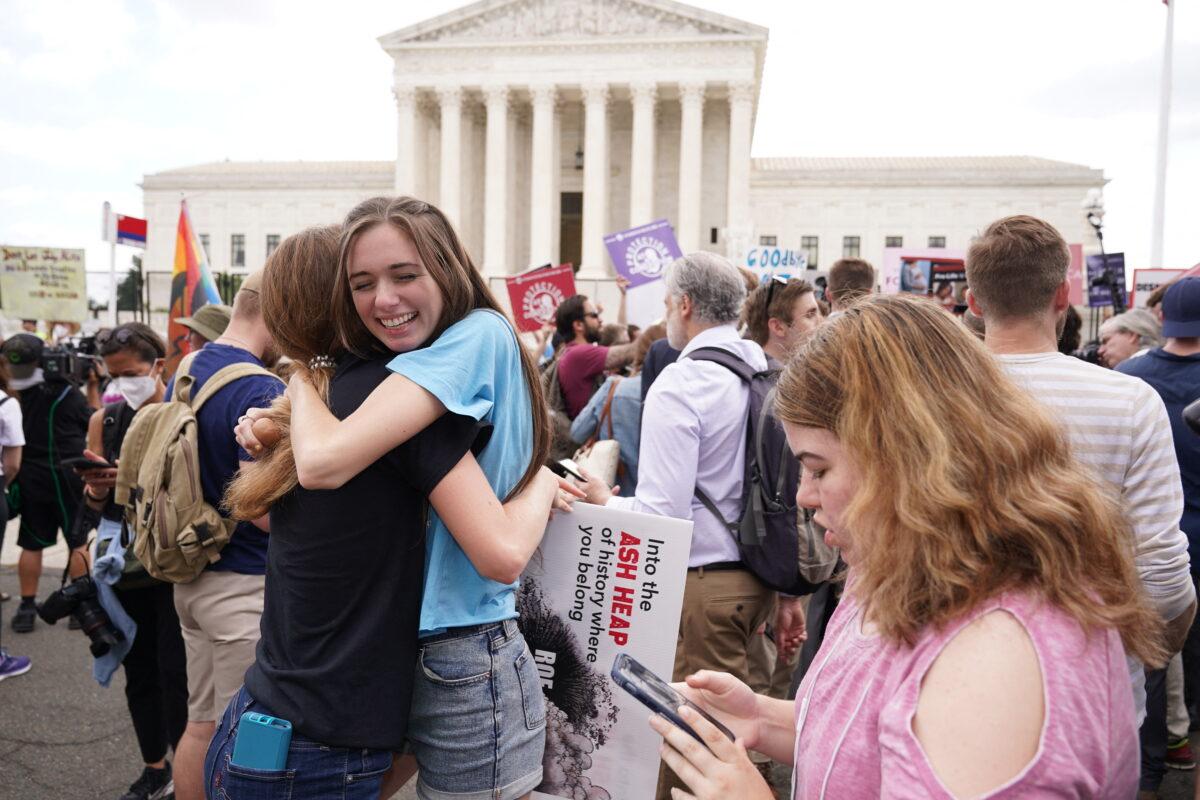Pro-life supporters hug outside the Supreme Court in Washington after the court formally overturned Roe v. Wade on June 24, 2022. (Mandel Ngan/AFP via Getty Images)