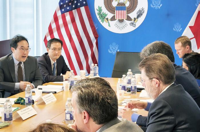 South Korea's Second Vice Foreign Minister Lee Do-hoon (L) and Ryu Peob-min (2nd from L), a trade ministry director, attend an inaugural meeting of the Minerals Security Partnership (MSP) in Toronto, Canada, on June 14, 2022. (Courtesy of the South Korean trade ministry)