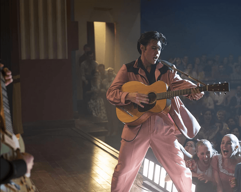 Elvis Presley (Austin Butler) slaying the ladies and infuriating their boyfriends, in "Elvis." (Warner Bros.)