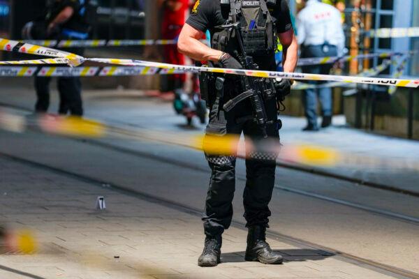 Police stand guard at the site of a mass shooting in Oslo, Norway, on June 25, 2022. (Javad Parsa/NTB via AP)