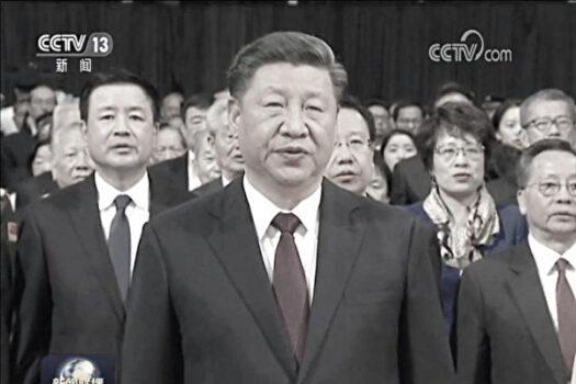 China's new minister of public security, Wang Xiaohong (L) accompanies Xi Jinping on the 20th anniversary of Macau's return to China in December 2019. (CCTV/Screenshot by The Epoch Times)