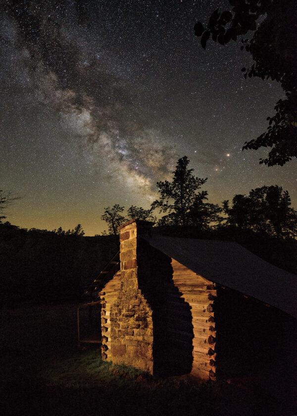 The Milky Way is visible over the historic Villines Homestead in Boxley Valley within the Buffalo National River area. (Tim Ernst)