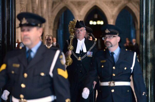 House of Commons Sergeant-at-Arms Kevin Vickers carries the mace during the Speakers Parade on Parliament Hill in Ottawa on Oct. 23, 2014. (The Canadian Press/Sean Kilpatrick)