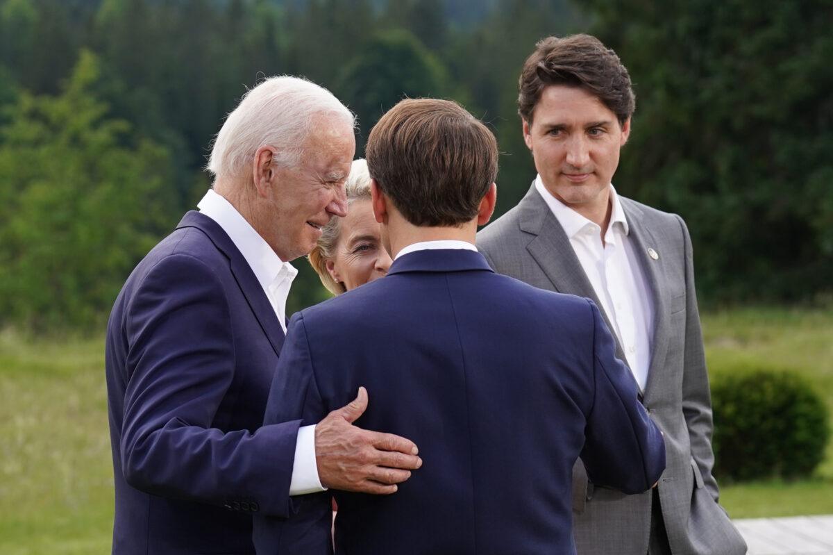 U.S. President Joe Biden, European Commission President Ursula von der Leyen, French President Emmanuel Macron, and Canadian Prime Minister Justin Trudeau attend the G-7 group photo on the first day of the G-7 summit at Schloss Elmau near Garmisch-Partenkirchen, Germany, on June 26, 2022. (Stefan Rousseau-Pool/Getty Images)