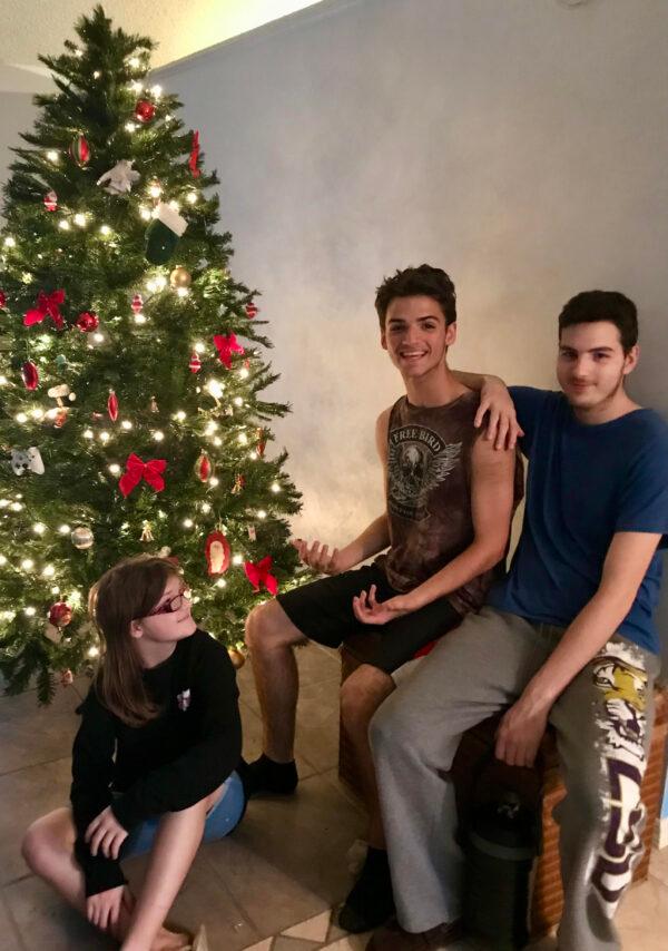 Angel and Kenneth Harrelson's children, Aimes, Nate, and Trey on Christmas day 2021. (Courtesy of Angel Harrelson)