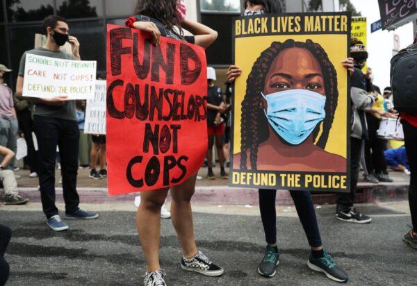 Black Lives Matter-Los Angeles supporters protest outside the Unified School District headquarters calling on the board of education to defund school police in Los Angeles on June 23, 2020. (Mario Tama/Getty Images)