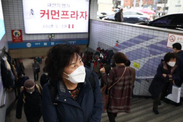 People walk in the Namdaemun market area of Seoul, South Korea on March 17, 2022. (Chung Sung-Jun/Getty Images)