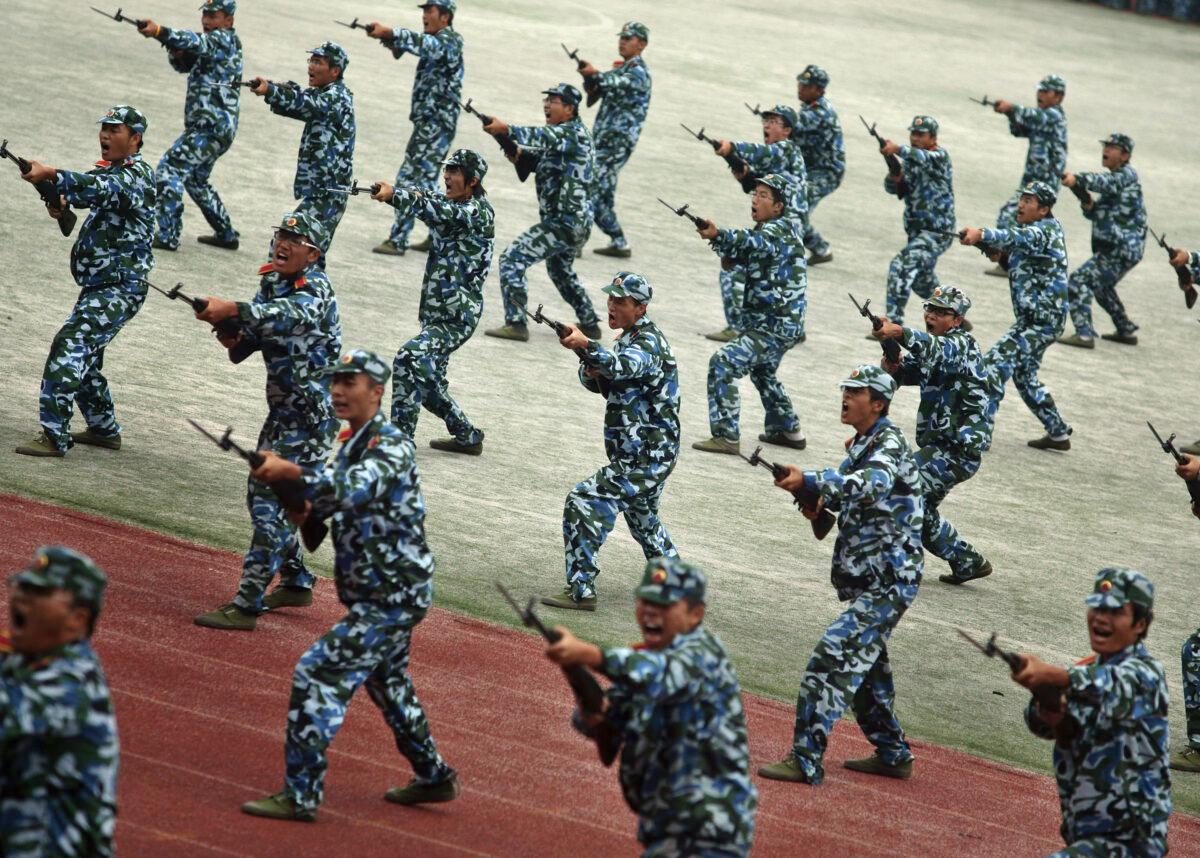 Freshmen practice fighting skills during military training at a university on Sept. 25, 2008, in Gaochun County of Jiangsu Province, China. (China Photos/Getty Images)
