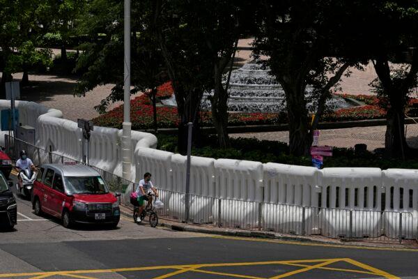 Water-filled barriers have been installed by police outside the Hong Kong Convention and Exhibition Center where the inauguration ceremony of the newly-appointed Chief Executive John Lee will take place in Hong Kong, on June 27, 2022. (Kin Cheung/AP Photo)