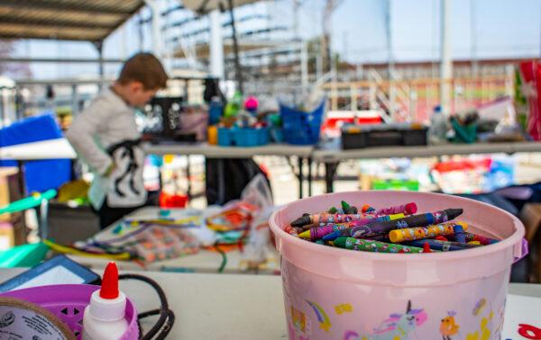 A Ukrainian child plays in the arts and crafts area at a refugee camp in Tijuana, Mexico, on April 27, 2022. (John Fredricks/The Epoch Times)