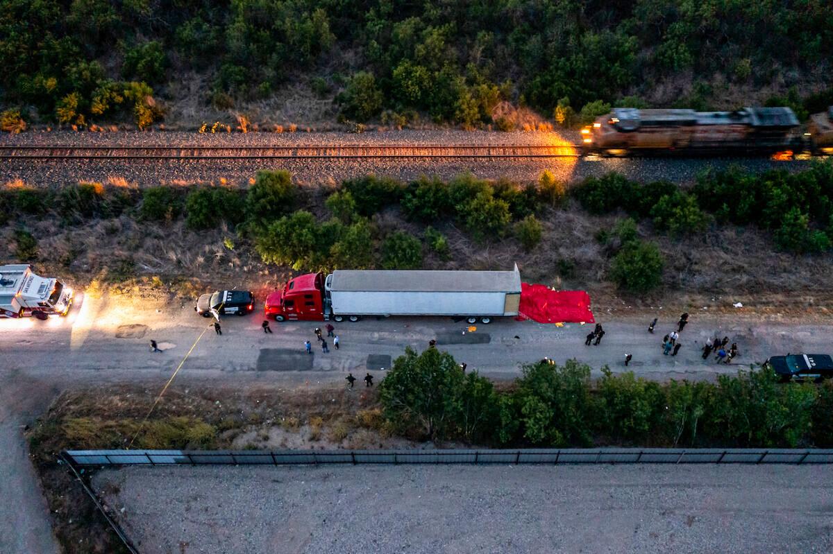 Members of law enforcement investigate a tractor-trailer in San Antonio, Texas, on June 27, 2022. (Jordan Vonderhaar/Getty Images)