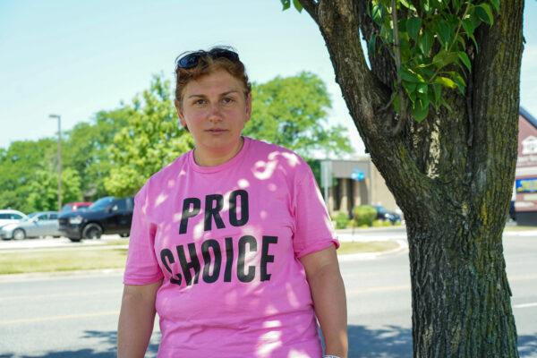 Veronica Khachatryan stands outside of a polling site in Palos Hills, Ill., on June 28, 2022. (Cara Ding/The Epoch Times)