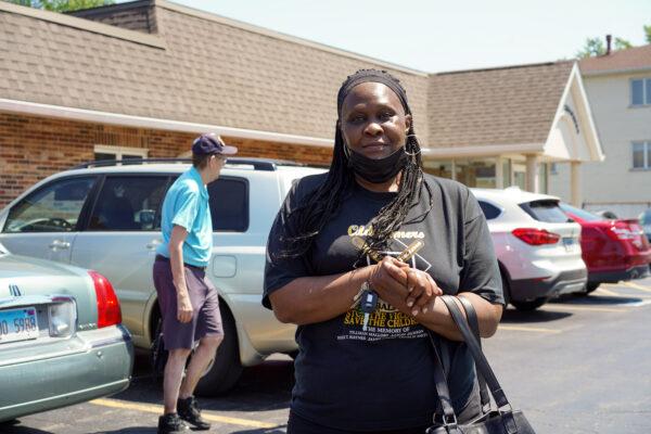 Alice Mister stands outside of a polling site in Palos Hills, Ill., on June 28, 2022. (Cara Ding/The Epoch Times)