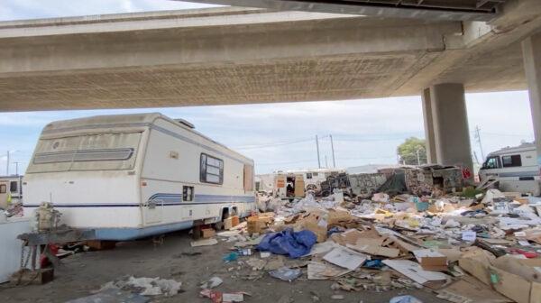 RVs parked in a homeless encampment under the I-880 bridge in Oakland, Calif., on May 26, 2022. (Cynthia Cai/NTD Television)