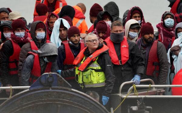 An undated image of a group of people thought to be migrants being brought into Dover, Kent. (Gareth Fuller/PA)