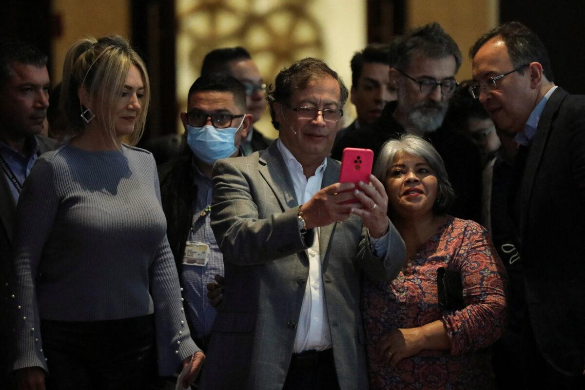 Gustavo Petro, presidential candidate for the political alliance 'Pacto Historico', poses for a picture with supporters before a national work table with political allies, in Bogota, Colombia, on June 17, 2022. (Luisa Gonzalez/Reuters)