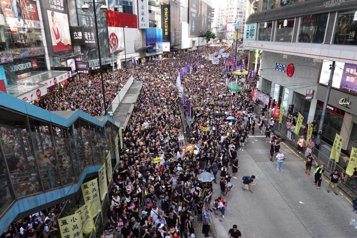 Protesters fill the streets in a march against a controversial extradition bill in Hong Kong on July 1, 2019. (Yu Gang/The Epoch Times)