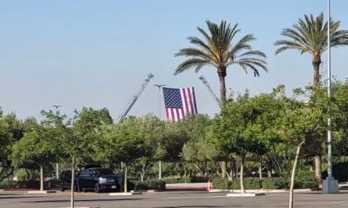 A flag is seen at the Toyota Arena where thousands of law enforcement personnel from throughout the region gathered for a memorial service in honor of two El Monte police officers in Ontario, Calif. on June 30, 2022. (Jackie Rios/NTD Television)