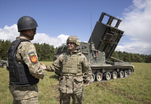 British Army personnel teach members of the Ukrainian armed forces how to operate a multiple-launch rocket systems (MLRS), on Salisbury Plain, Wiltshire, England, on June 25, 2022. (PA Media)