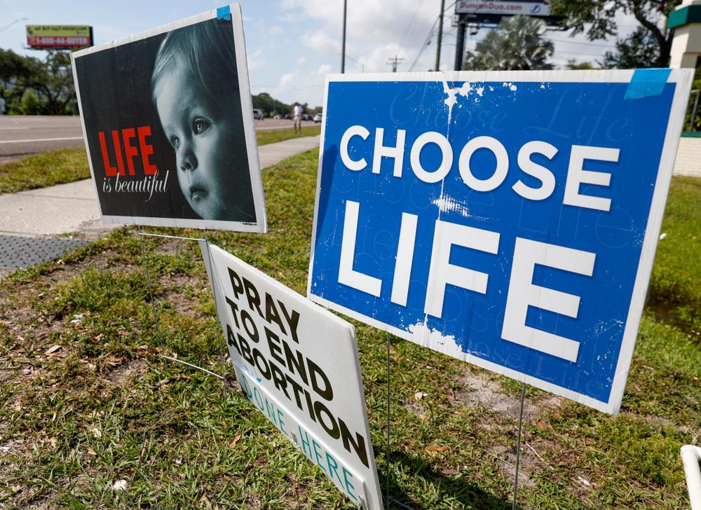 Pro-life signs are seen outside the All Women’s Health Center of Clearwater on May 3. The Supreme Court has struck down the landmark 1973 Roe v. Wade case that recognized a Constitutional right to an abortion. States can now ban the procedure. (TNS)