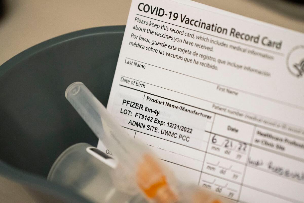Doses of the Pfizer Covid-19 vaccine and vaccination record cards await pediatric patients at UW Medical Center–Roosevelt in Seattle, Washington, on June 21, 2022. (David Ryder/Getty Images)